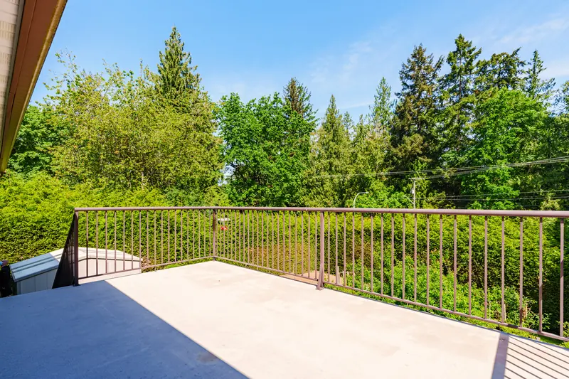 The deck, looking out over the garden and trees